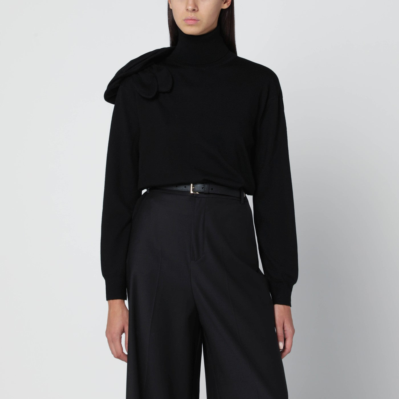 Black turtleneck sweater with flower detail