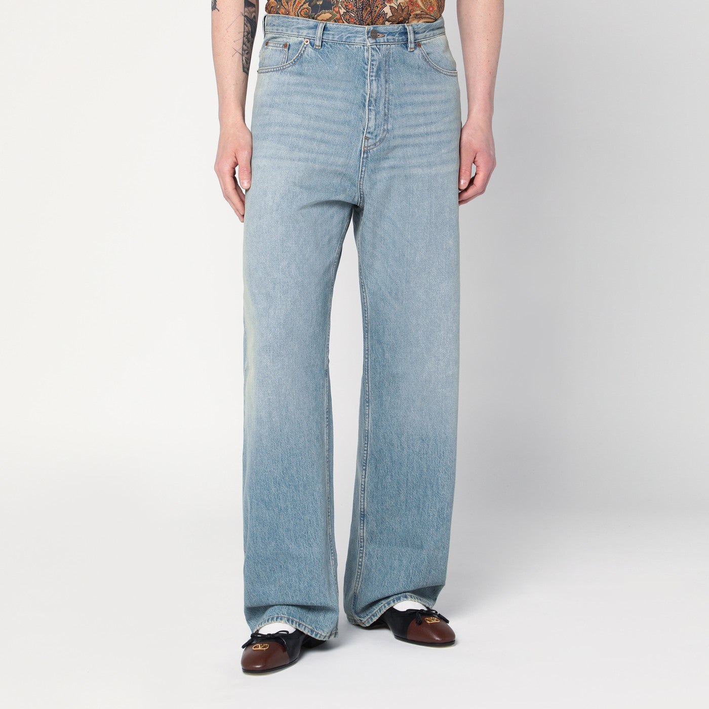 Light blue jeans with washed effect Light blue jeans with washed effect