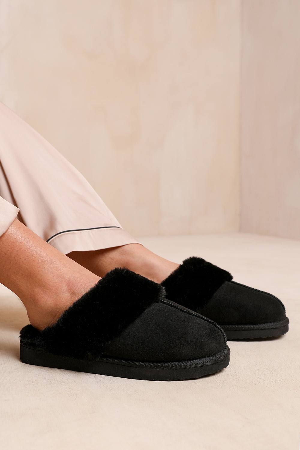 Where’s That From ‘comfort’ Slip On Slippers With Fur Trim Suede In Black